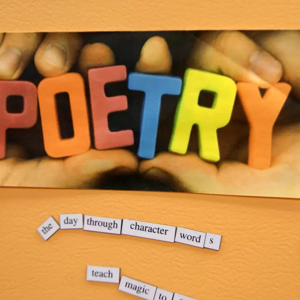 Pictured: the word poetry in large colorful block letters, underneath magnetic words for the thought - the day through character words device teach magic scattered on a golden-yellow background